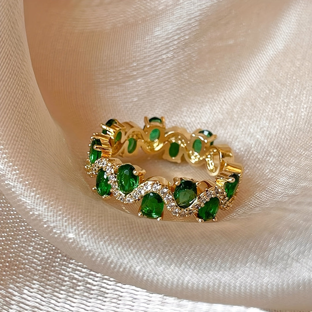 Anillo abierto ajustable con detalles verdes · Dorado