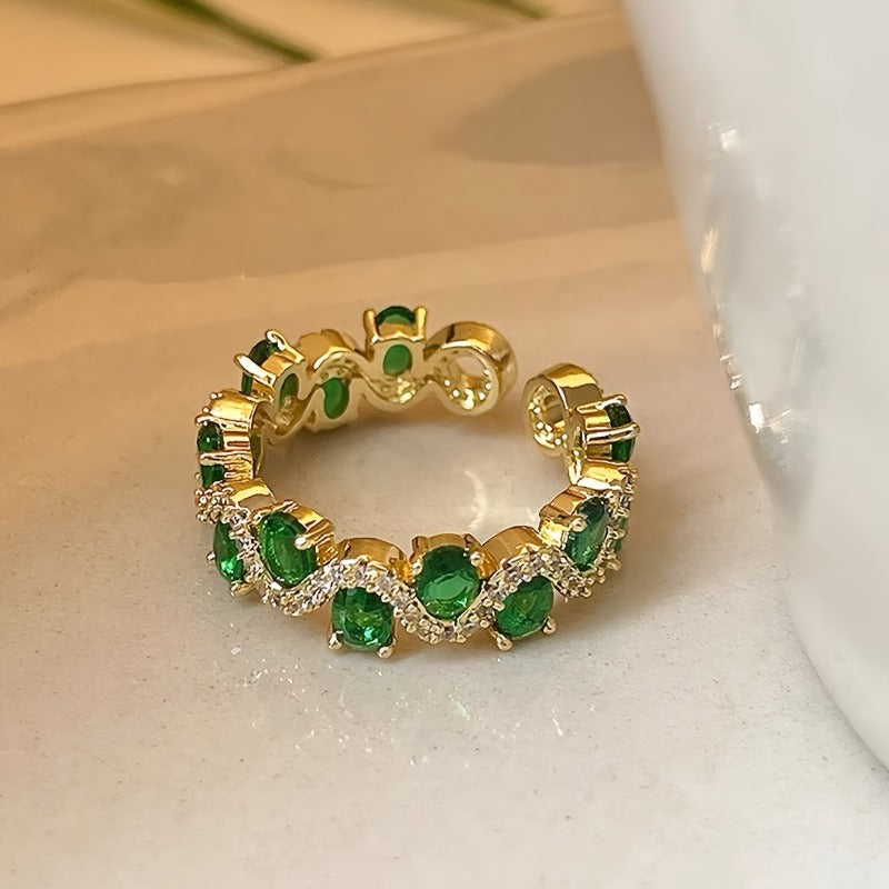 Anillo abierto ajustable con detalles verdes · Dorado
