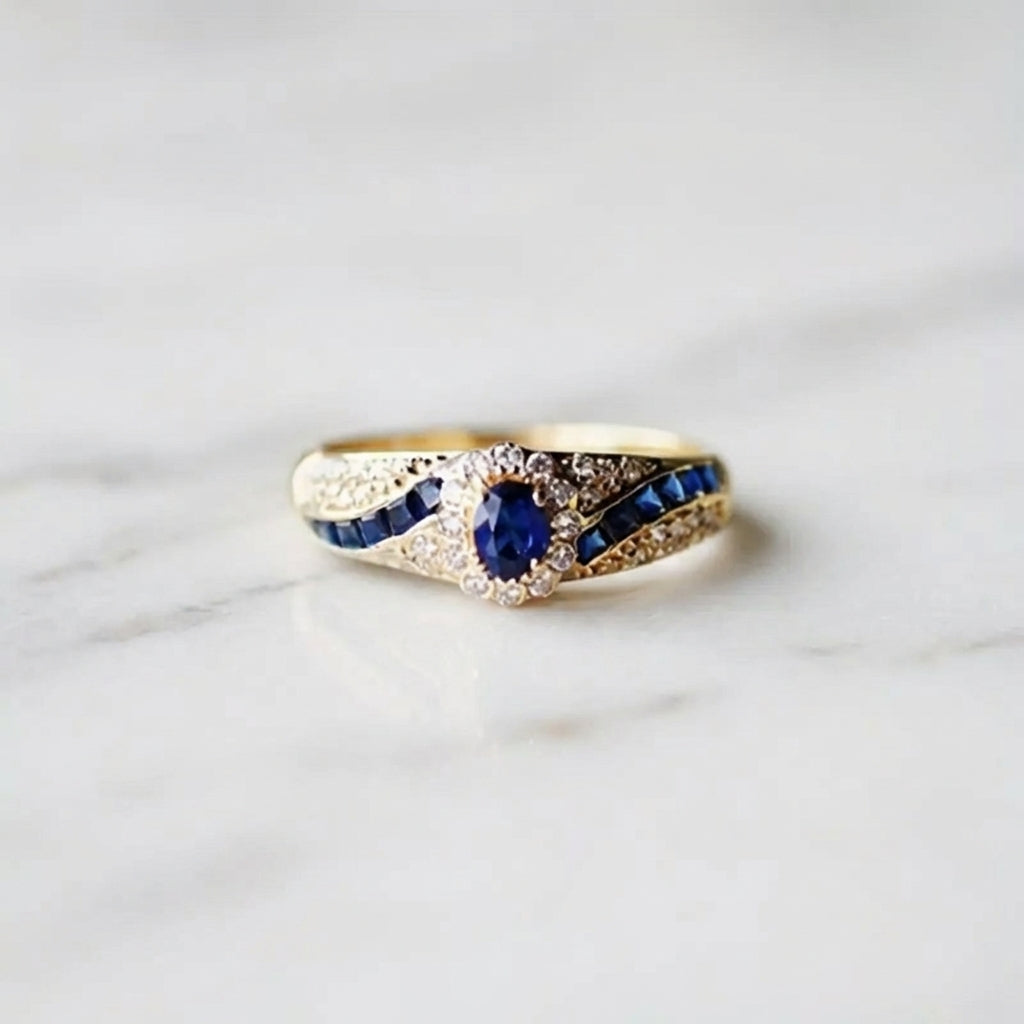 Anillo promesa con detalle azul · Dorado