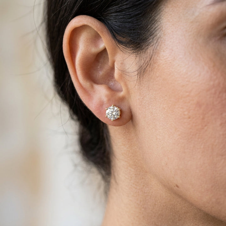 Pendientes con destello · Dorado