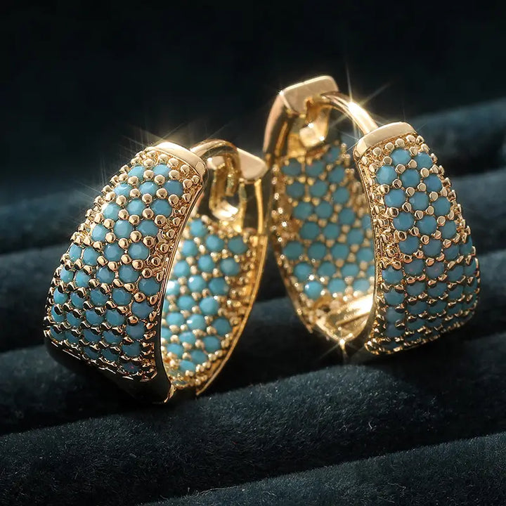 Pendientes de aro con cuentas turquesa · Dorado
