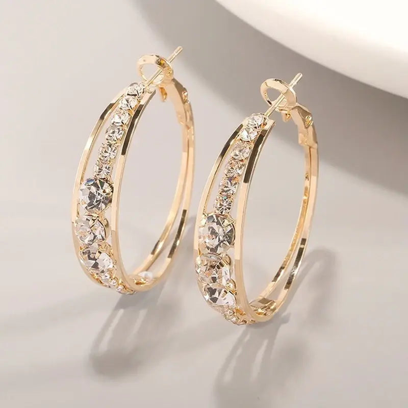 Pendientes de aro con brillos · Dorado
