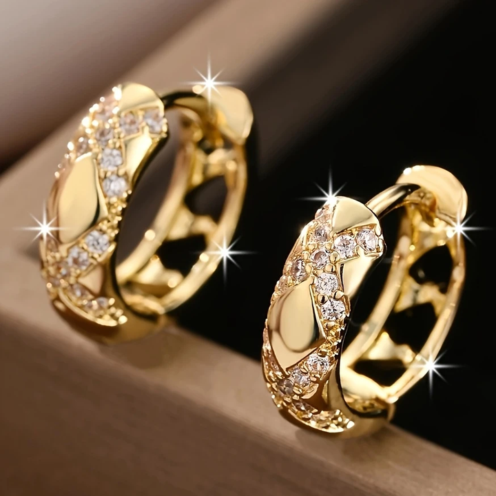 Pendientes colgantes con abertura y destello · Dorado