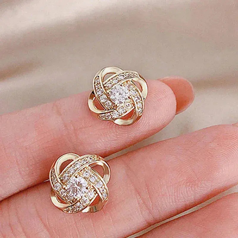 Pendientes de cruz con motivo floral
