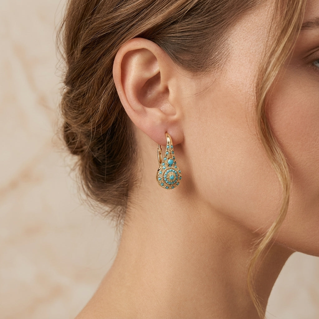 Pendientes con detalle turquesa · Dorado