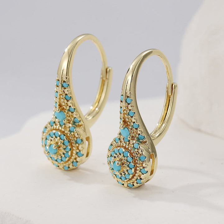 Pendientes con detalle turquesa · Dorado