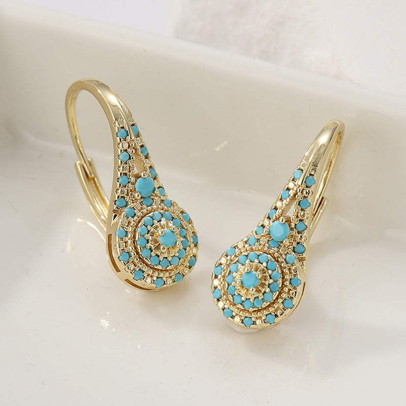 Pendientes con detalle turquesa · Dorado