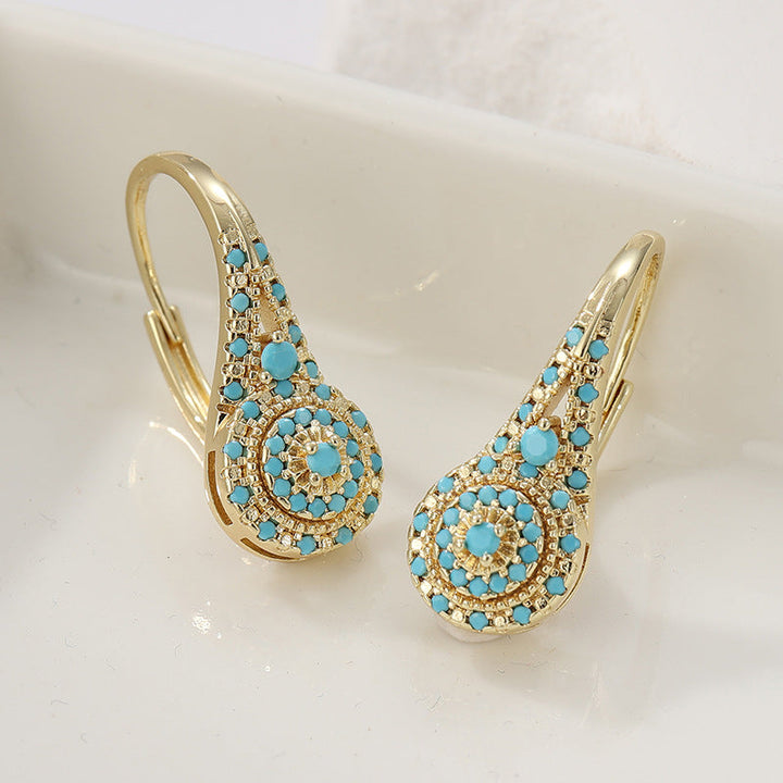 Pendientes con detalle turquesa · Dorado