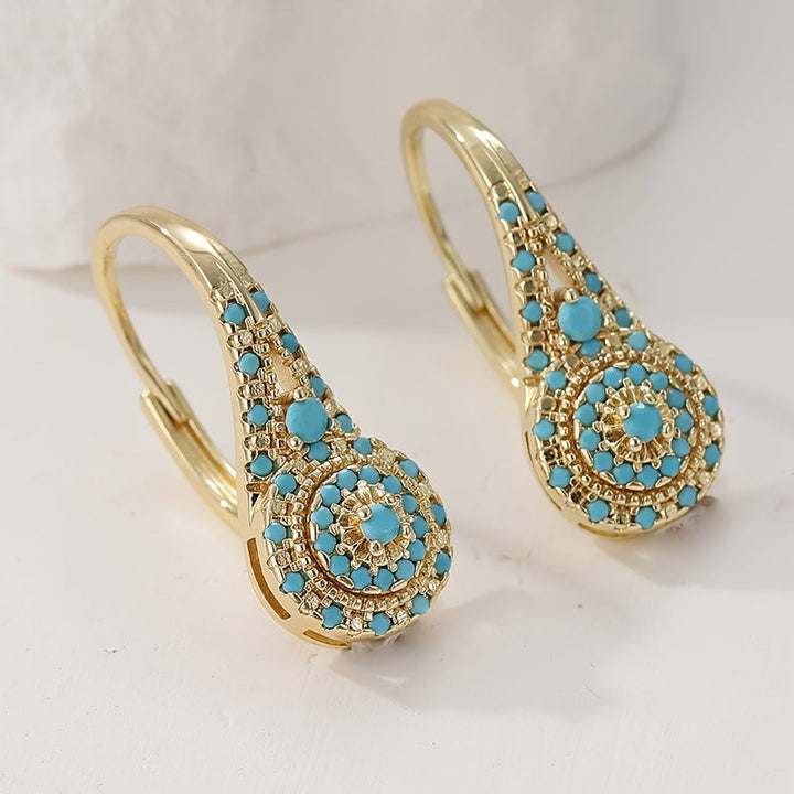 Pendientes con detalle turquesa · Dorado