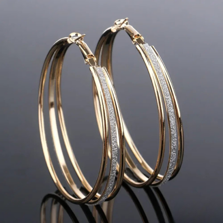 Pendientes de aro triples · Dorado