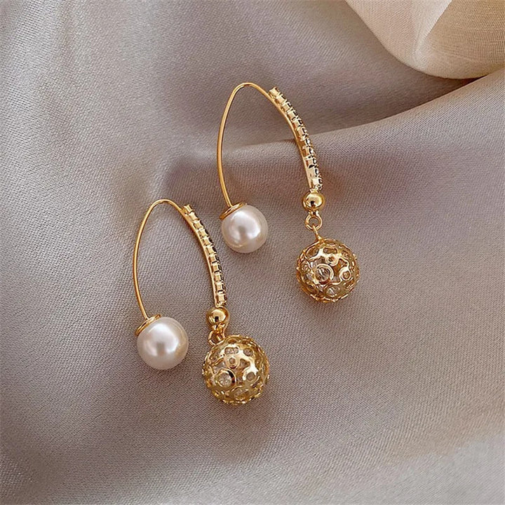 Pendientes retro con margaritas · Dorado