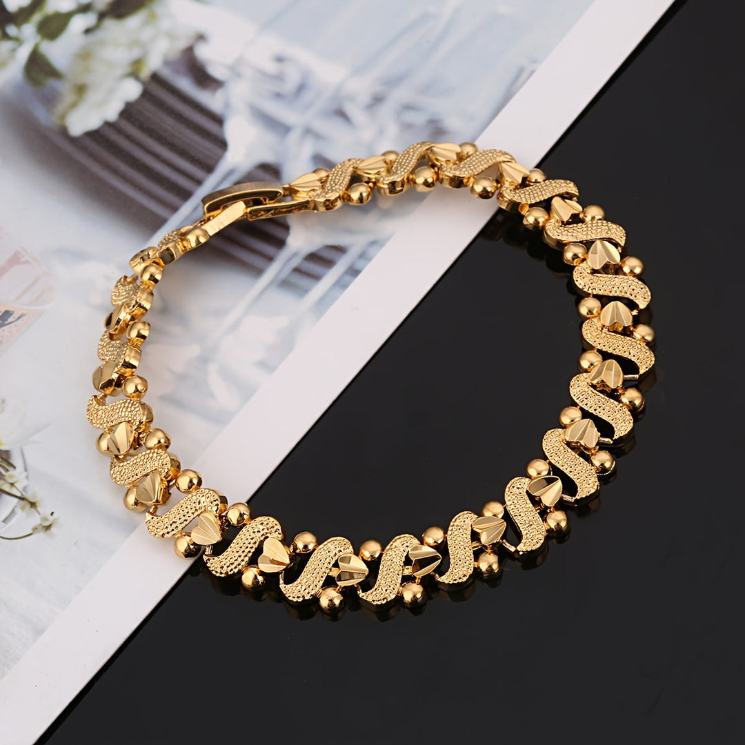 Pulsera ondulada flor de lis · Dorado
