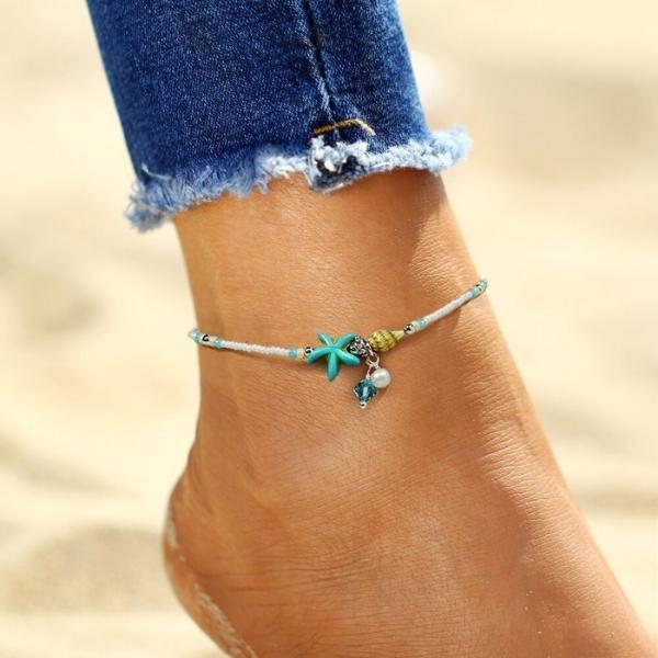 Tobillera con estrellas y concha · Dorado