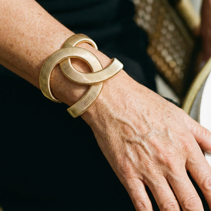 Brazalete doble cruzado · Dorado