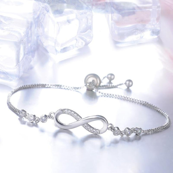 Pulsera infinito ajustable · Dorado, plateado o rosado
