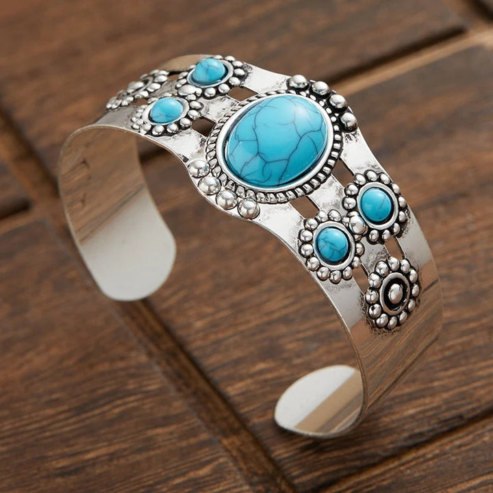 Pulsera retro abierta con detalle turquesa · Plateado