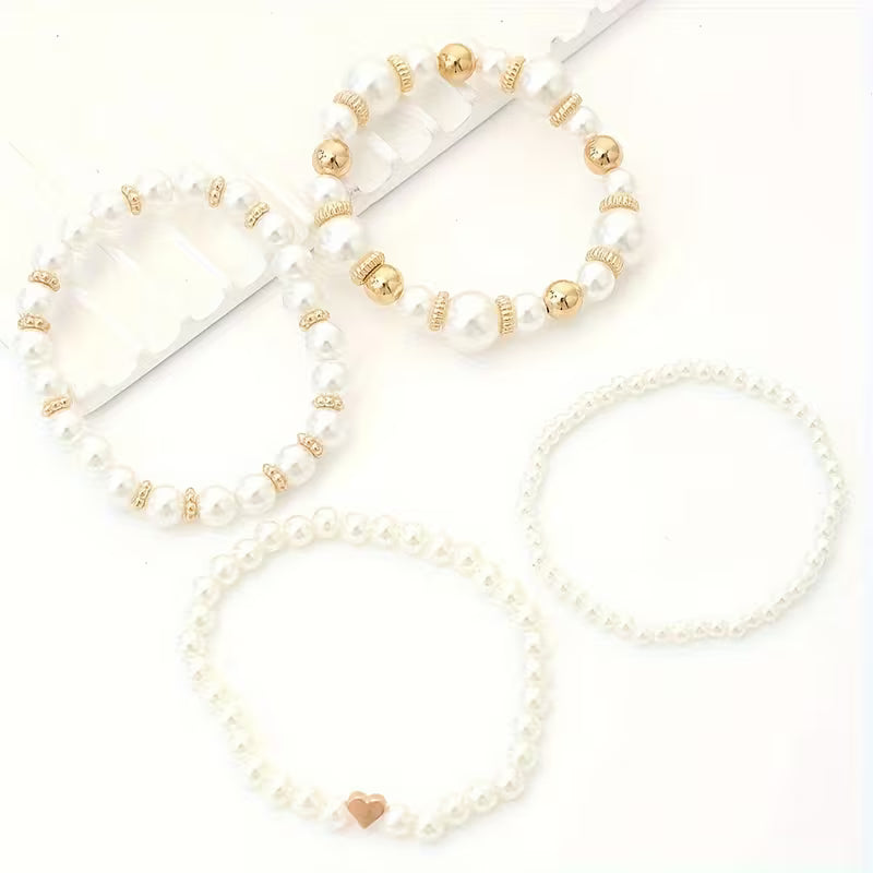 Pulseras perladas blancas