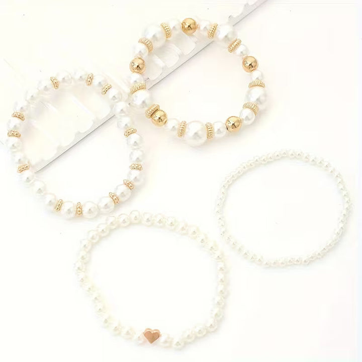 Pulseras perladas blancas