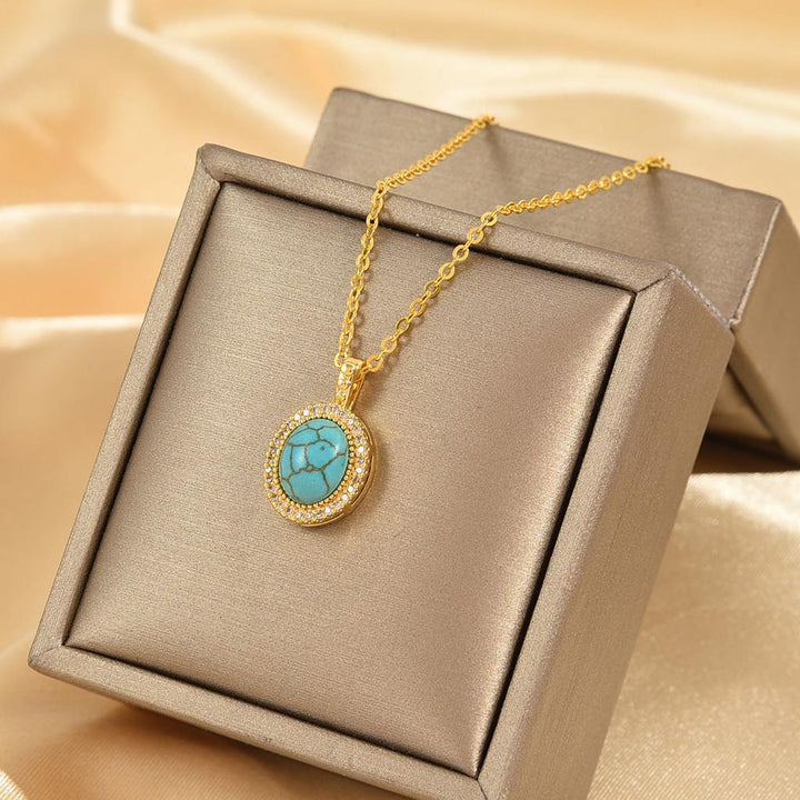 Collar Calysse con flor azul · Dorado