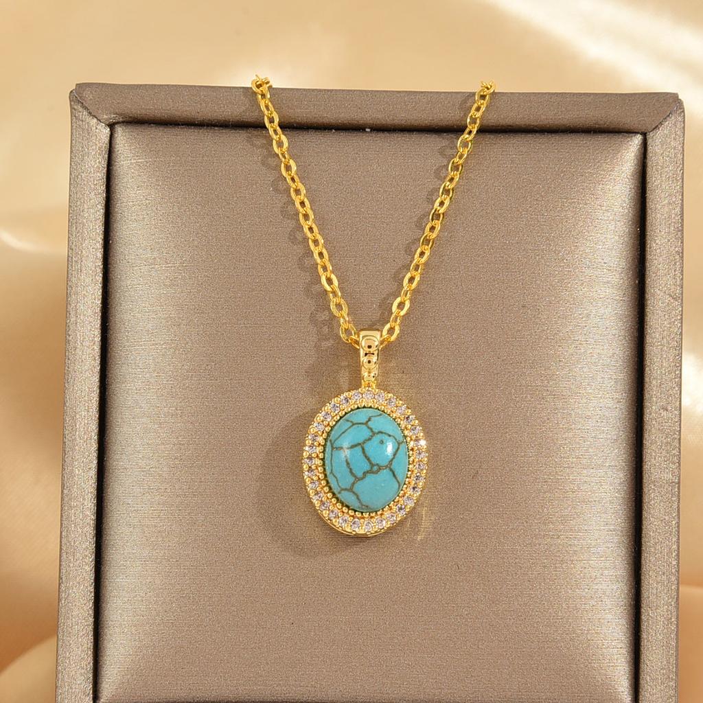Collar Calysse con flor azul · Dorado