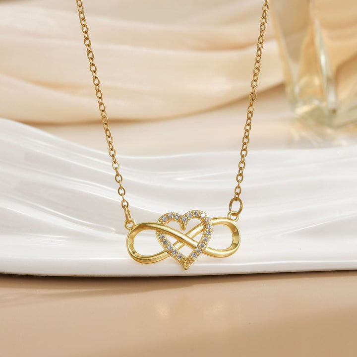 Collar infinito con nudo de amor · Dorado