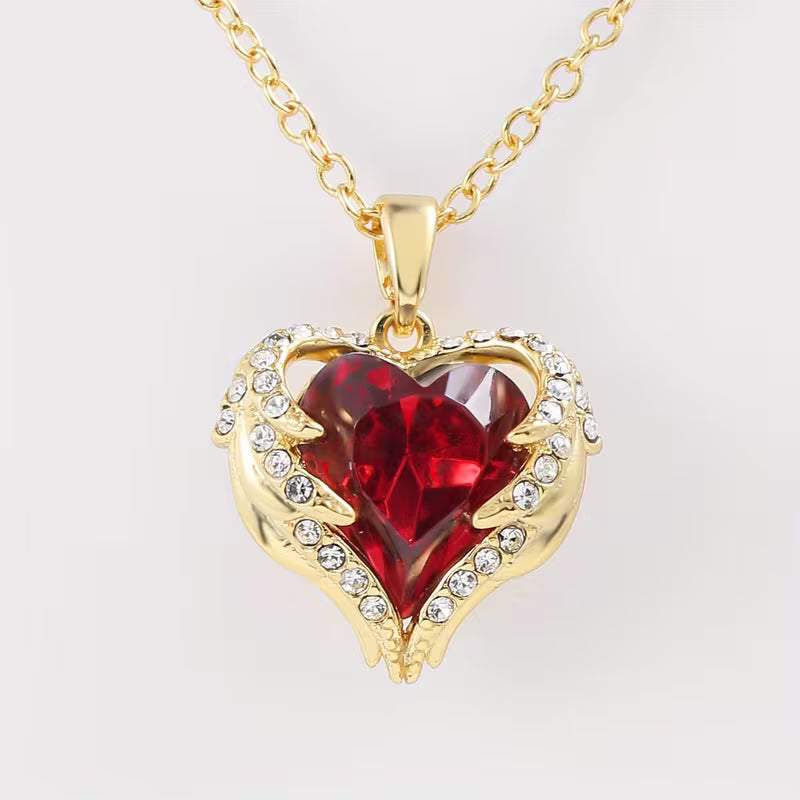 Collar de corazón rojo con alas de ángel · Dorado