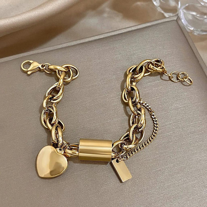 Pulsera gruesa con candado y corazón · Dorado o plateado