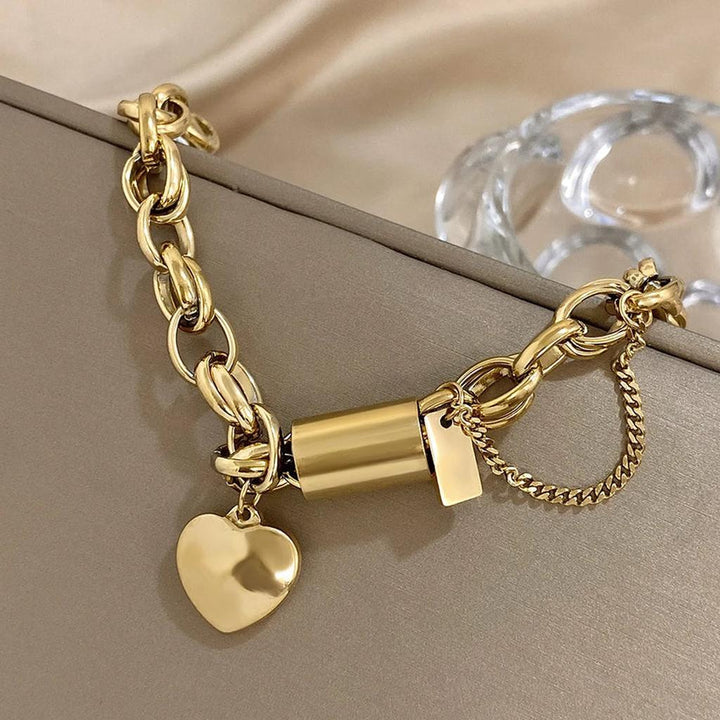 Pulsera gruesa con candado y corazón · Dorado o plateado