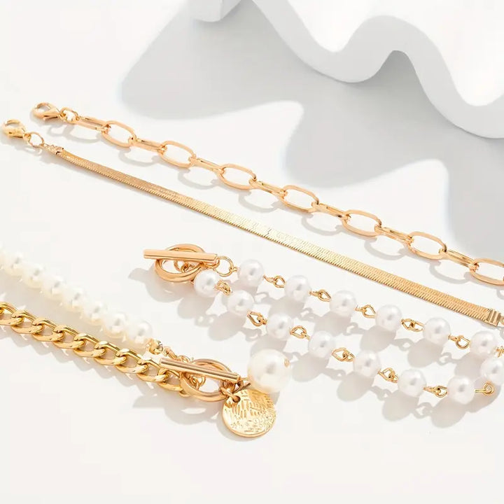 Set de pulseras con serpiente y eslabones · Dorado