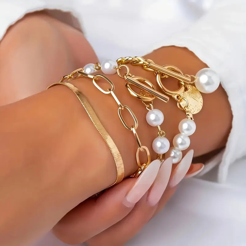 Set de pulseras con serpiente y eslabones · Dorado