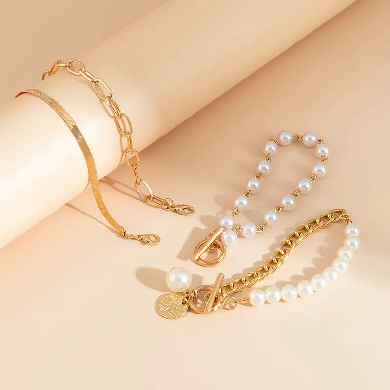 Set de pulseras con serpiente y eslabones · Dorado
