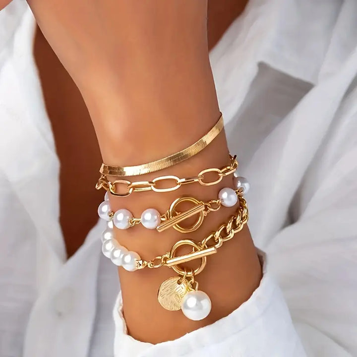Set de pulseras con serpiente y eslabones · Dorado