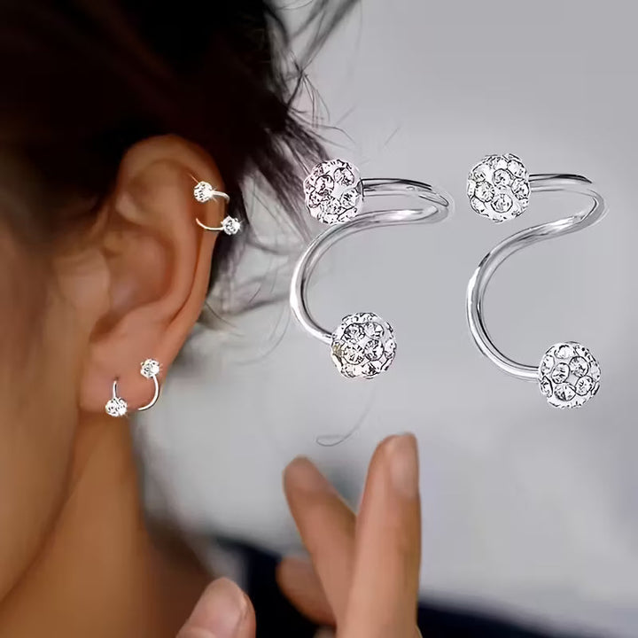 Set de pendientes ligeros con espirales y brillos · Plateado