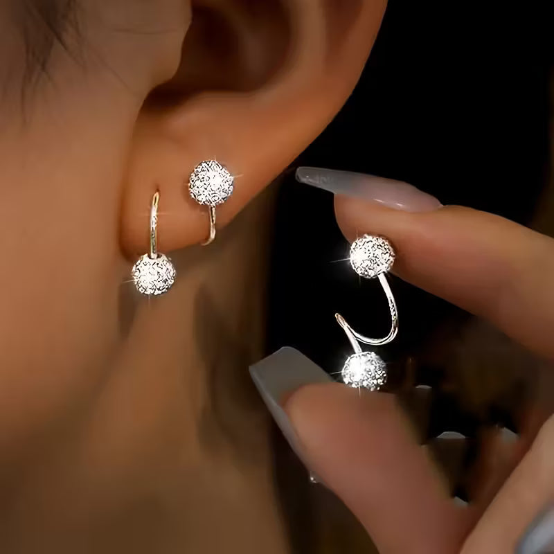 Set de pendientes ligeros con espirales y brillos · Plateado