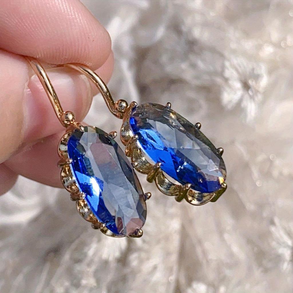 Pendientes de flor azul · Dorado