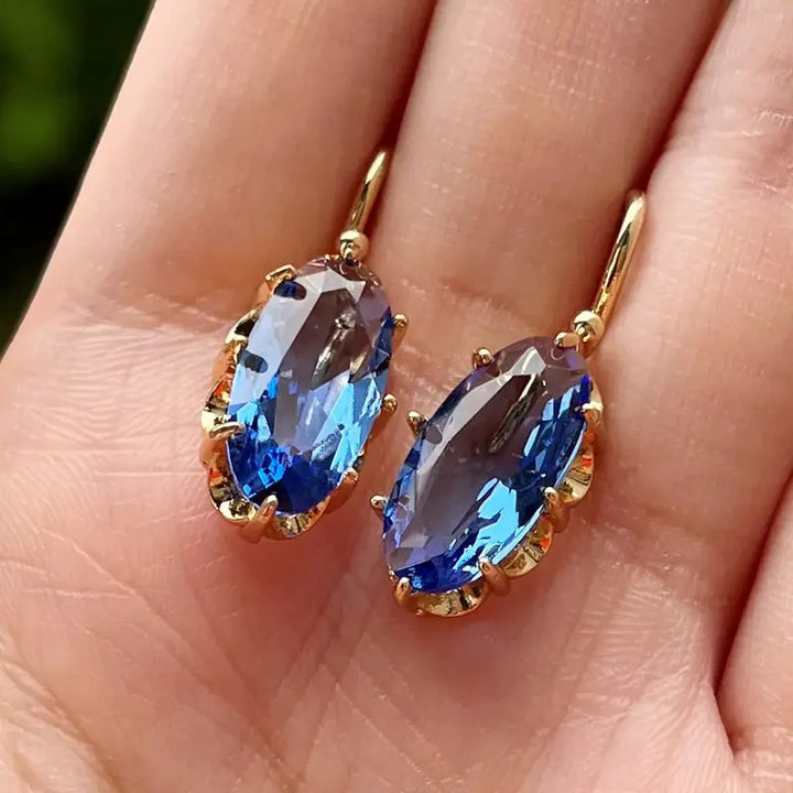 Pendientes de flor azul · Dorado