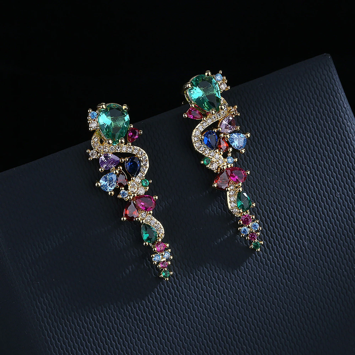 Pendientes largos con brillos multicolor · Dorado