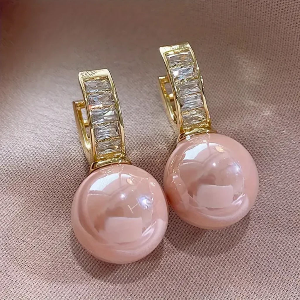 Pendientes con cuenta perlada rosa y brillos · Dorado