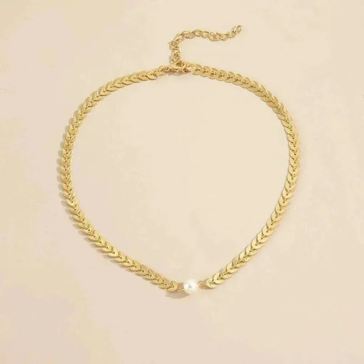 Collar griego espiga con detalle perlado · Dorado