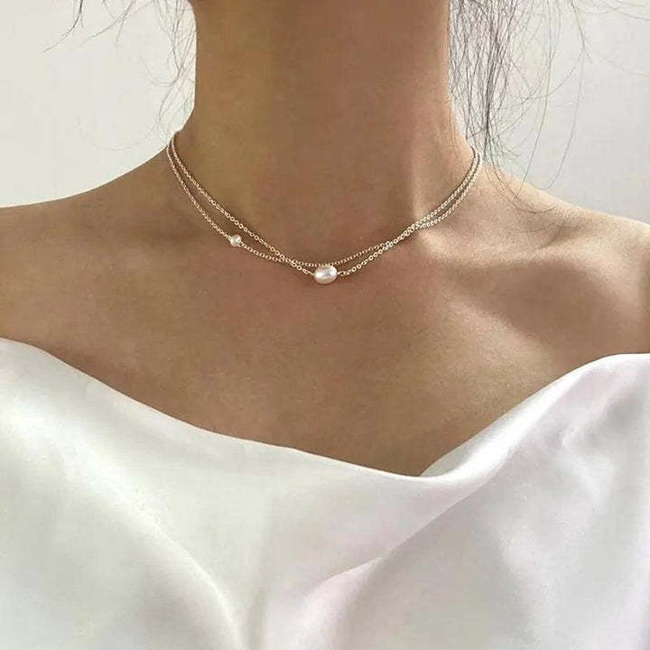 Collar doble fino con detalle perlado · Dorado