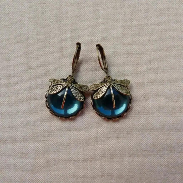 Pendientes libélula con esfera de color · Dorado