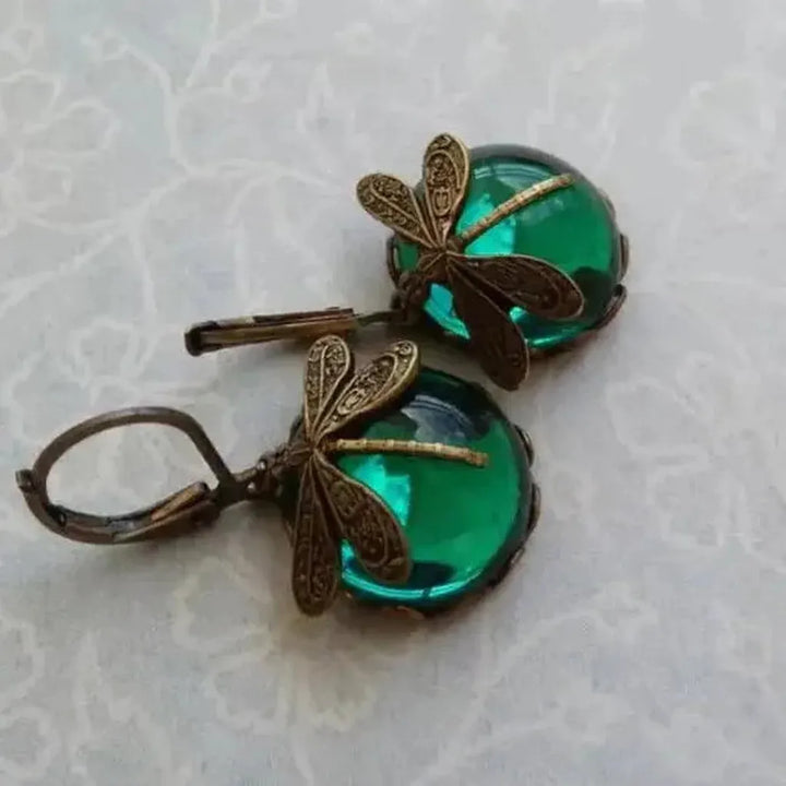Pendientes libélula con esfera de color · Dorado