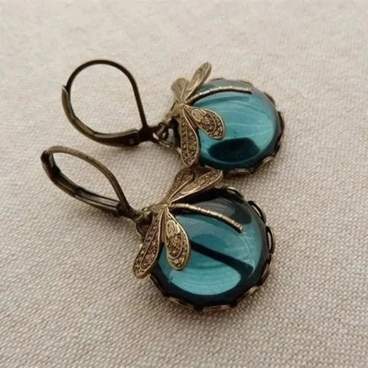 Pendientes libélula con esfera de color · Dorado