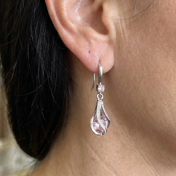 Pendientes Livia Lumen con giro · Plateado