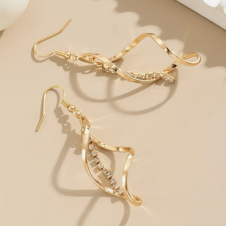 Pendientes largos Espiral de Sol · Dorado