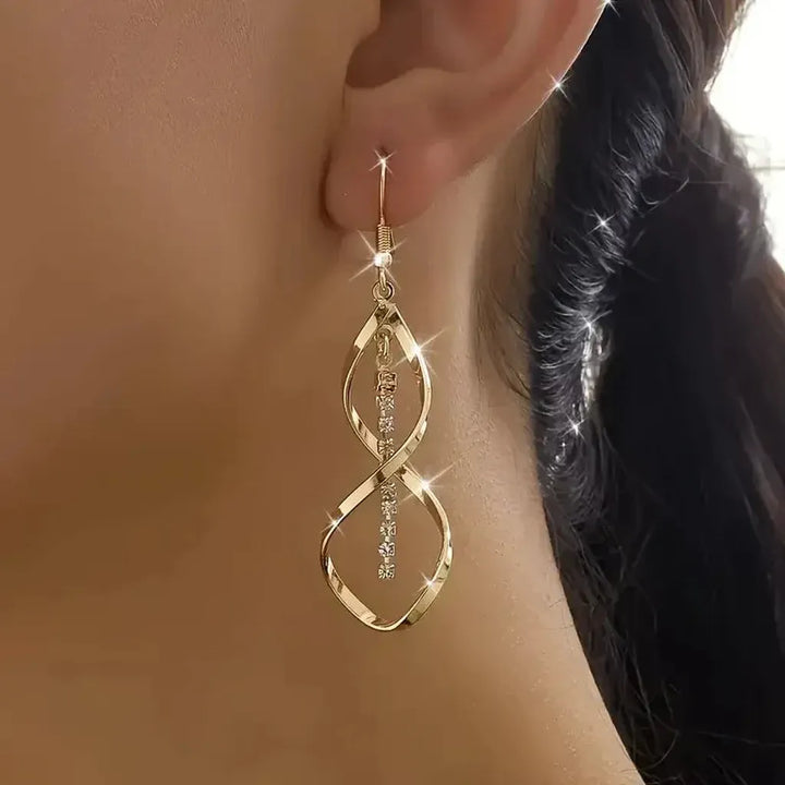 Pendientes largos Espiral de Sol · Dorado