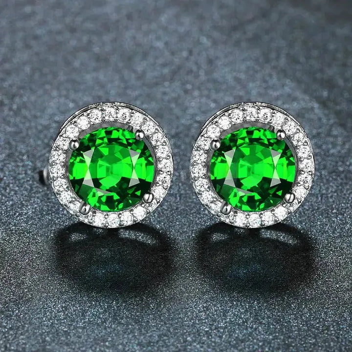 Pendientes de botón verde esmeralda con halo · Plateado
