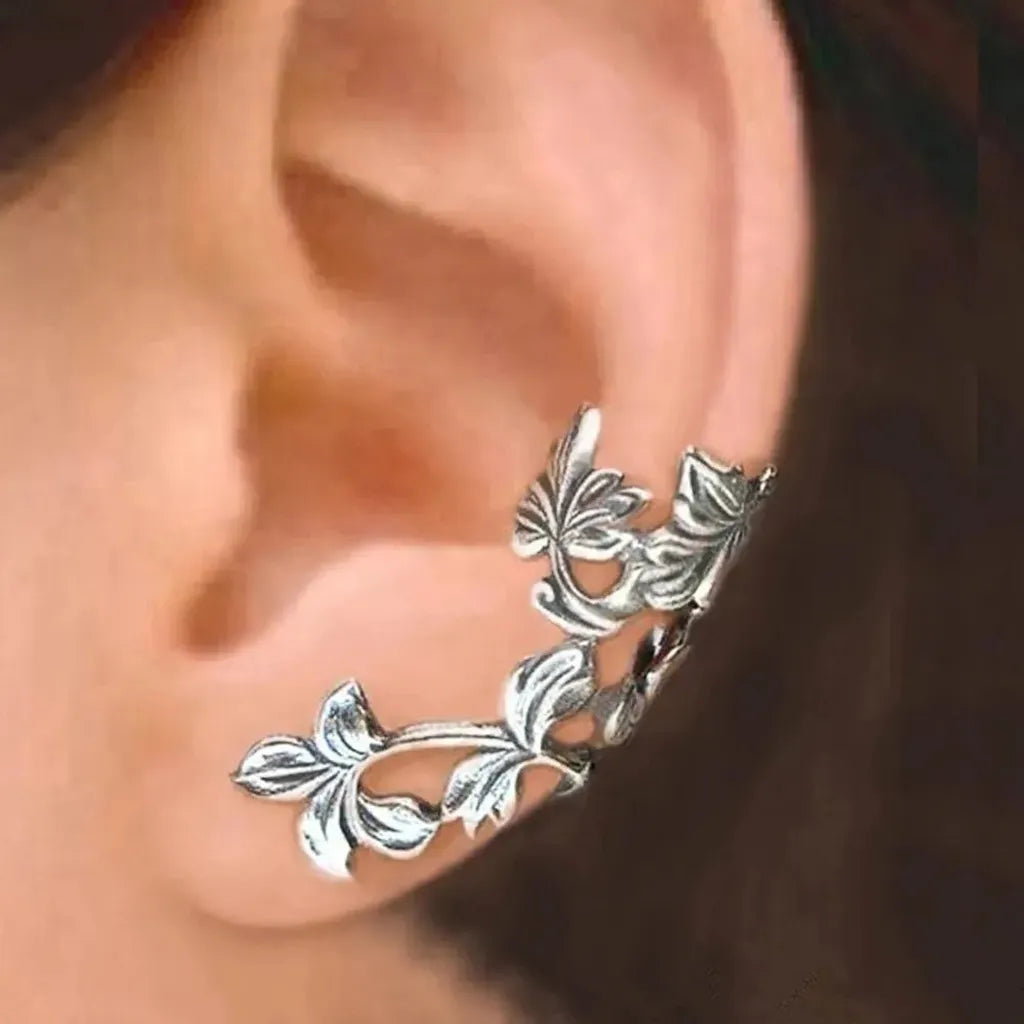 Pendientes de clip con flores retro · Plateado