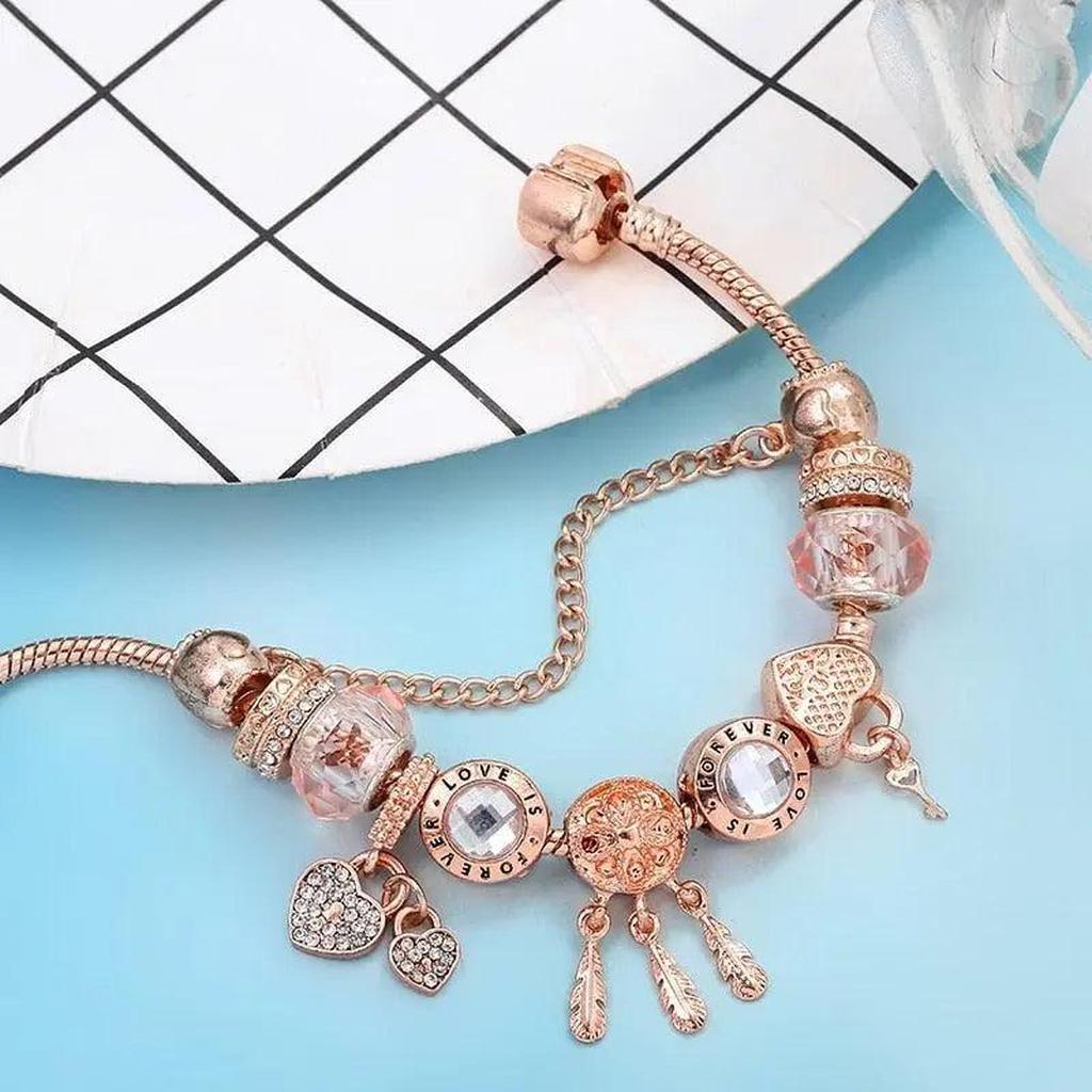 Pulsera de charms atrapasueños · Rosado