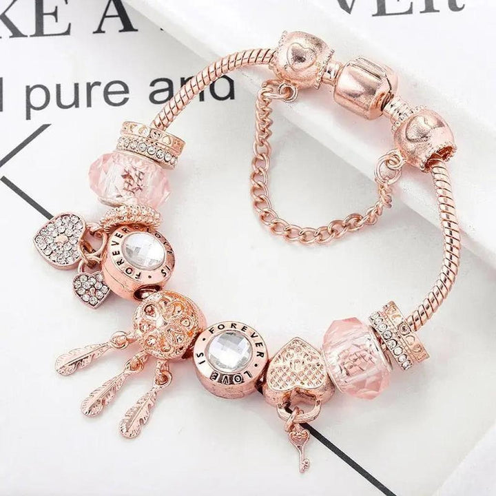Pulsera de charms atrapasueños · Rosado